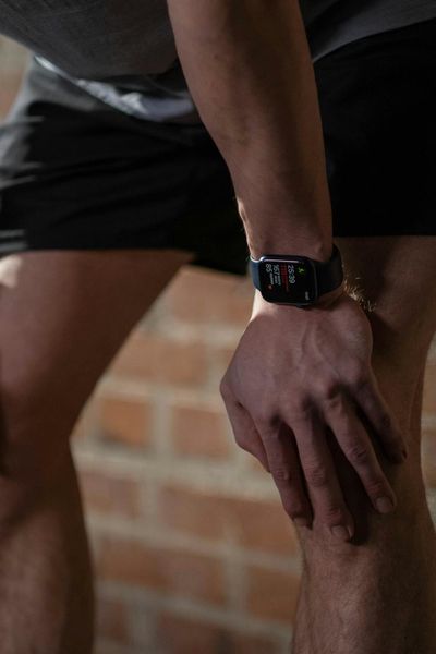 Close-up of a person's hands resting on their knees during meditation.